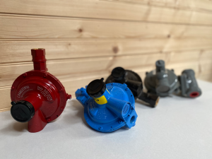 An assortment of regulators for propane gas supply systems.